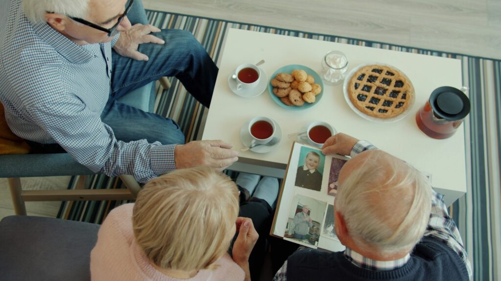 Family members sitting together in conversation, representing different perspectives within family relationships.