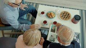 Family members sitting together in conversation, representing different perspectives within family relationships.
